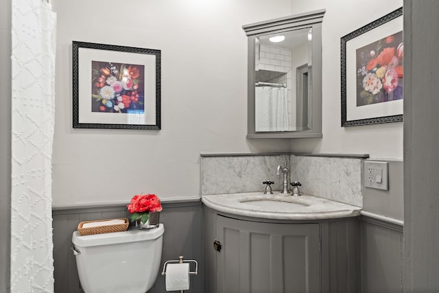875 N Parish Rd, Turner, ME 04282 - full bathroom featuring a wainscoted wall, vanity, and toilet