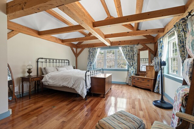 875 N Parish Rd, Turner, ME 04282 - bedroom featuring baseboards, light wood-style flooring, and beam ceiling