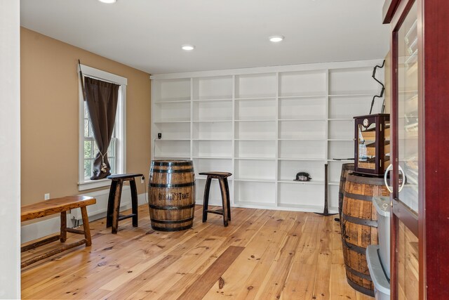 875 N Parish Rd, Turner, ME 04282 - unfurnished room with built in features, baseboards, recessed lighting, and hardwood / wood-style floors