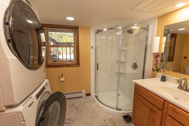 full bathroom with stacked washer / drying machine, a baseboard heating unit, a shower stall, marble finish floors, and vanity