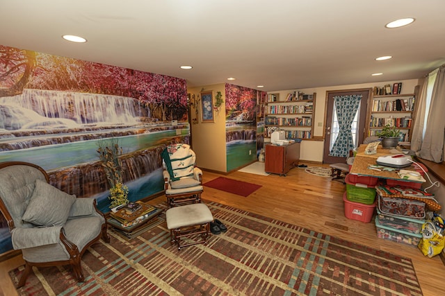 sitting room with wood finished floors and recessed lighting