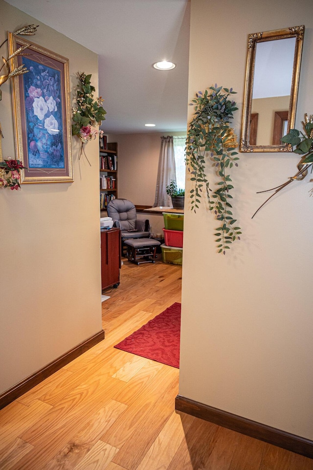 hall with recessed lighting and wood finished floors