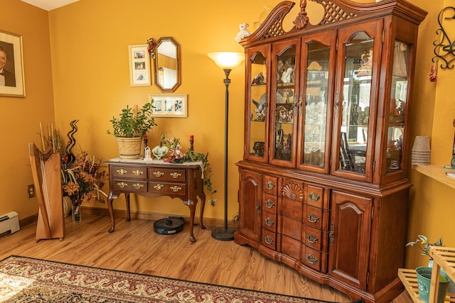 dining area featuring wood finished floors and baseboards
