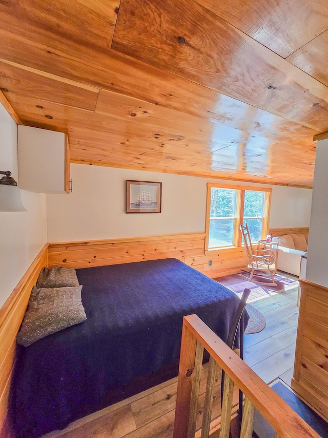 bedroom featuring wood-type flooring and wood ceiling