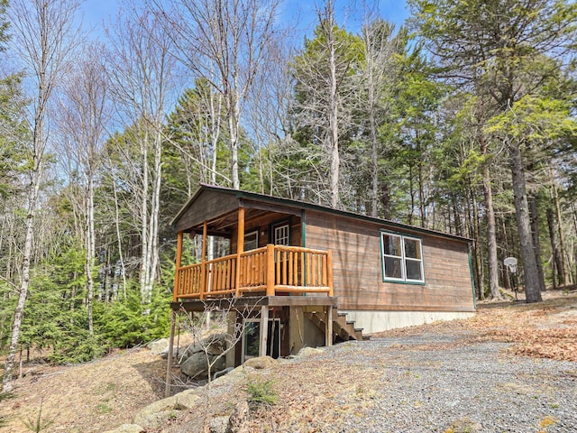view of front of home with a deck and stairs