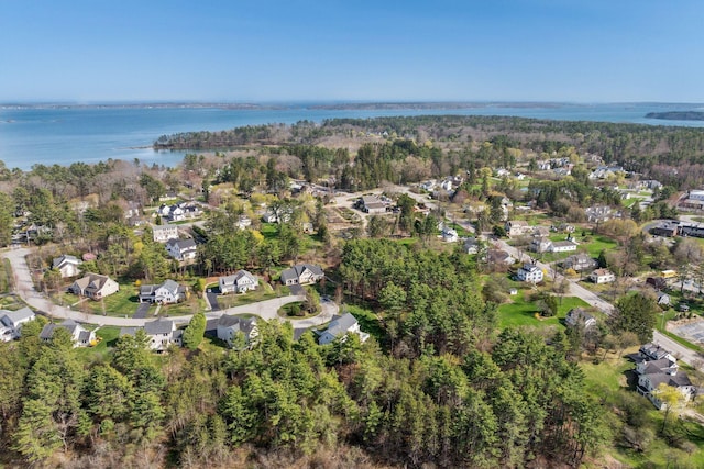 drone / aerial view with a water view and a residential view