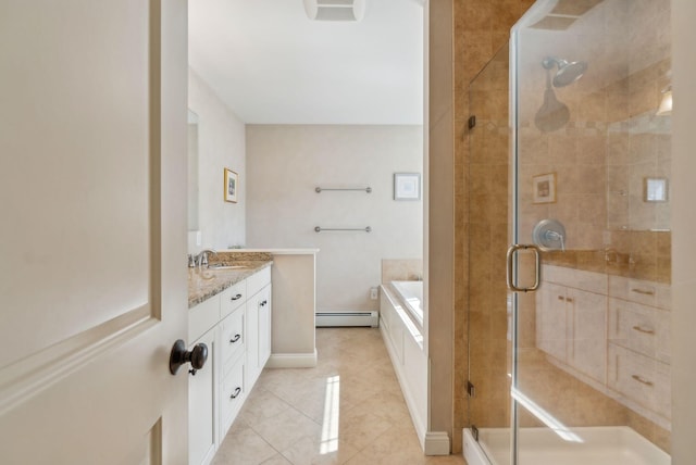 bathroom featuring tile patterned floors, a shower stall, a garden tub, and vanity