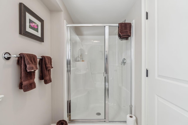 bathroom featuring a shower stall