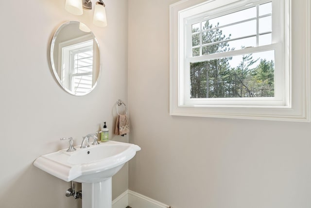 bathroom featuring baseboards and plenty of natural light