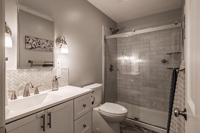 full bath with vanity, marble finish floor, toilet, a stall shower, and backsplash