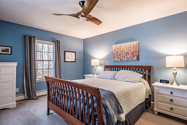 bedroom featuring a baseboard radiator, baseboards, ceiling fan, and carpet flooring