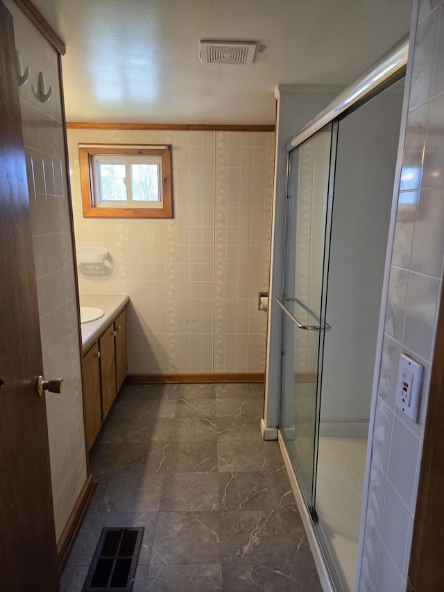 full bathroom featuring vanity, visible vents, marble finish floor, and a stall shower