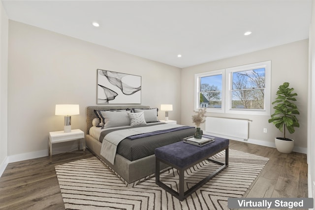 bedroom with baseboards, recessed lighting, radiator heating unit, and wood finished floors