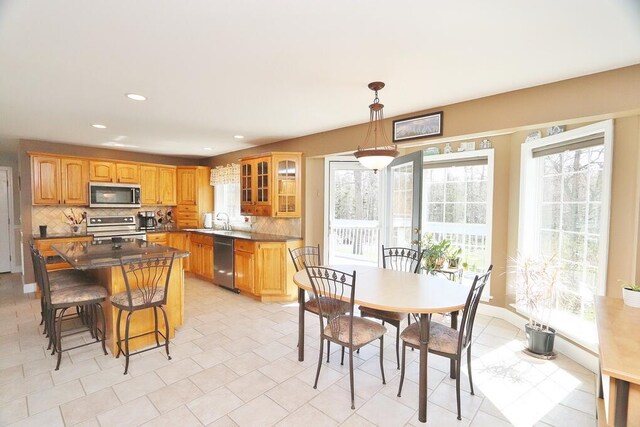 dining room with recessed lighting and light tile patterned flooring