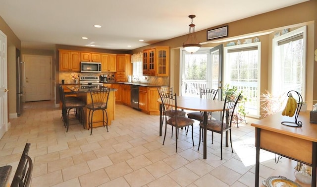 dining space featuring a healthy amount of sunlight and recessed lighting
