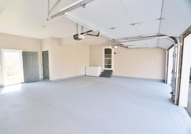 garage featuring a garage door opener