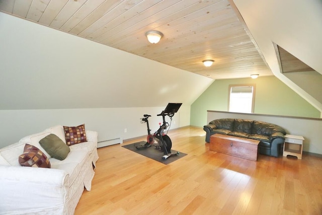 exercise area with wood ceiling, a baseboard heating unit, wood finished floors, and vaulted ceiling