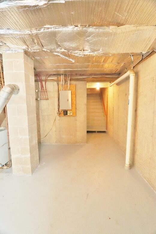 unfinished below grade area featuring electric panel