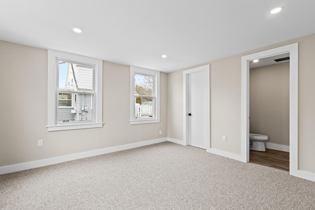 unfurnished bedroom with carpet flooring, recessed lighting, and baseboards