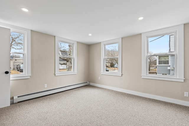carpeted empty room featuring recessed lighting, baseboards, and baseboard heating