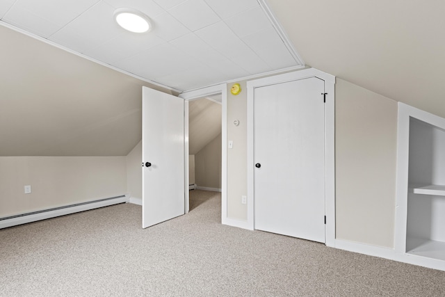 additional living space featuring carpet flooring, lofted ceiling, and a baseboard radiator