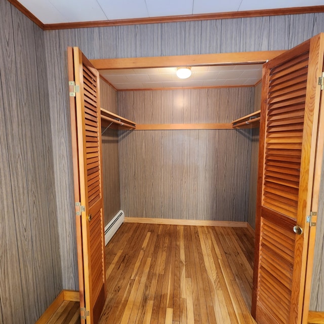 34 Chase Ave, Mexico, ME 04257 - spacious closet with a baseboard heating unit and wood-type flooring