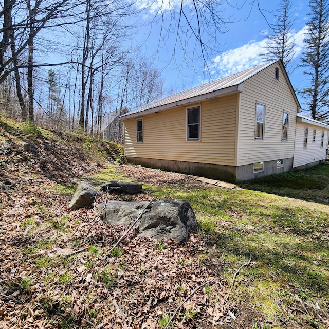 34 Chase Ave, Mexico, ME 04257 - view of property exterior with metal roof