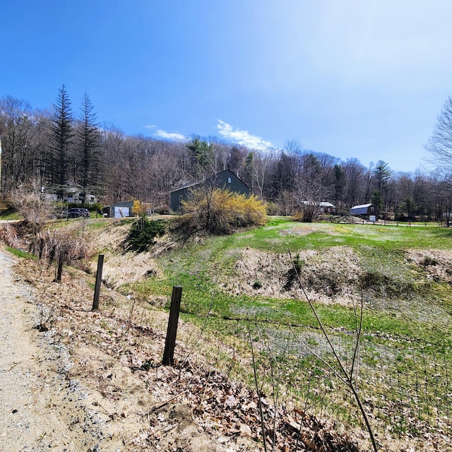 34 Chase Ave, Mexico, ME 04257 - view of street featuring a wooded view