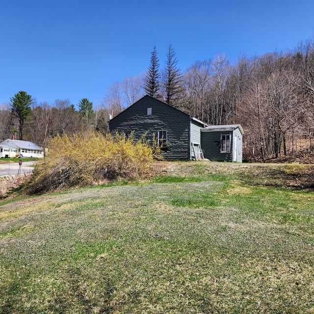 34 Chase Ave, Mexico, ME 04257 - view of home's exterior with a yard and an outdoor structure