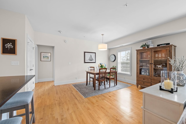 75 Clearwater Dr Unit 305, Falmouth, ME 04105 - dining room featuring baseboards and light wood finished floors