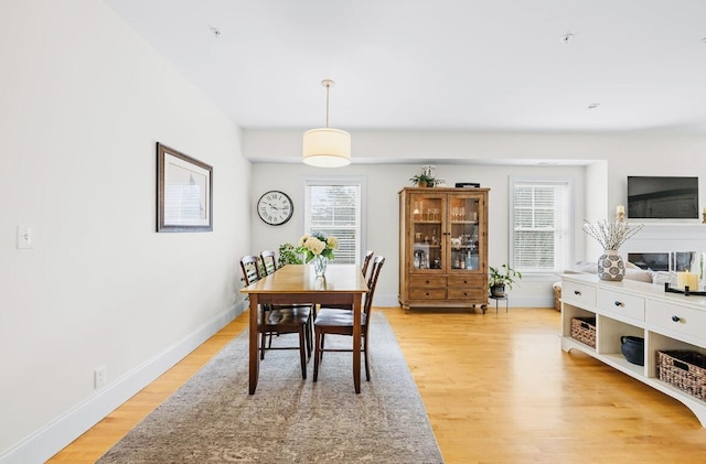 75 Clearwater Dr Unit 305, Falmouth, ME 04105 - dining room featuring light wood-style floors, baseboards, and a wealth of natural light