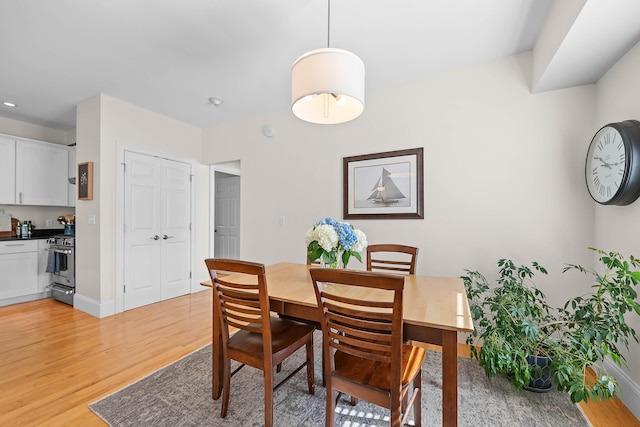 75 Clearwater Dr Unit 305, Falmouth, ME 04105 - dining space with light wood-type flooring and baseboards