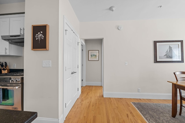 75 Clearwater Dr Unit 305, Falmouth, ME 04105 - hallway with baseboards and light wood-type flooring