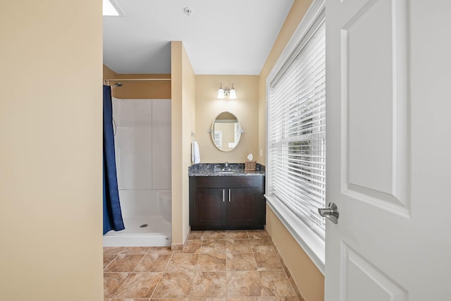 75 Clearwater Dr Unit 305, Falmouth, ME 04105 - bathroom with a shower with curtain, baseboards, vanity, and stone finish flooring