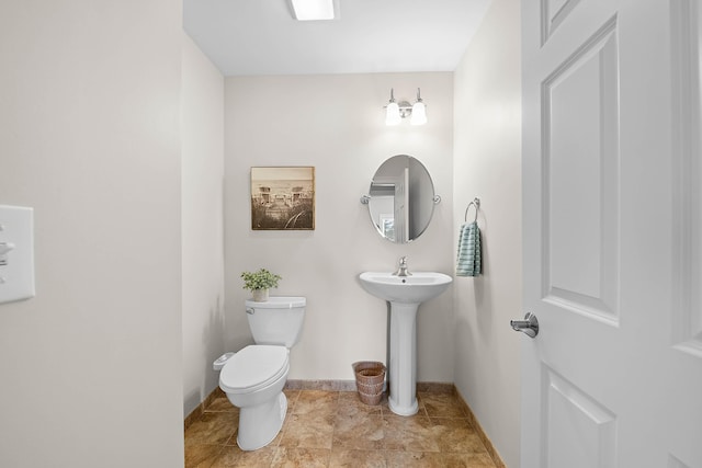 75 Clearwater Dr Unit 305, Falmouth, ME 04105 - half bath with toilet, baseboards, and a sink