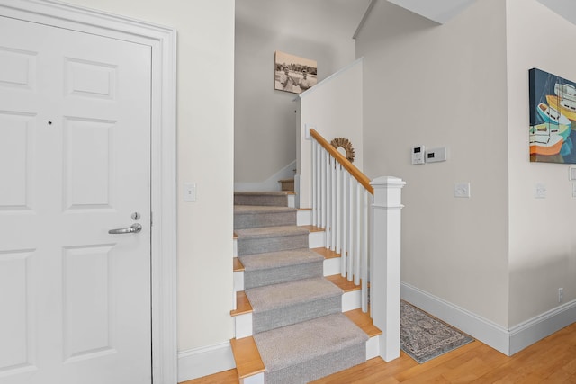 75 Clearwater Dr Unit 305, Falmouth, ME 04105 - staircase with baseboards and wood finished floors