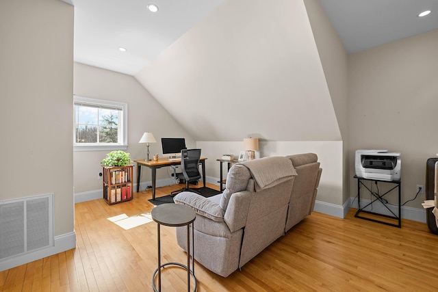 75 Clearwater Dr Unit 305, Falmouth, ME 04105 - living area featuring visible vents, vaulted ceiling, baseboards, light wood finished floors, and heating unit