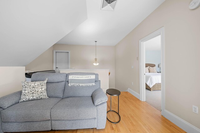 75 Clearwater Dr Unit 305, Falmouth, ME 04105 - living room with baseboards, visible vents, and light wood-style flooring