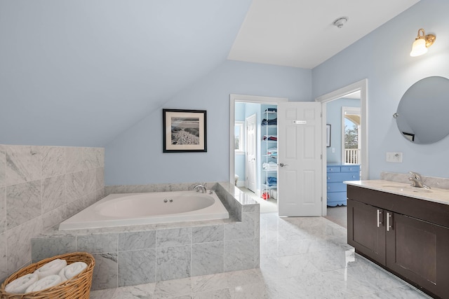 75 Clearwater Dr Unit 305, Falmouth, ME 04105 - full bath featuring vanity, vaulted ceiling, a bath, and marble finish floor