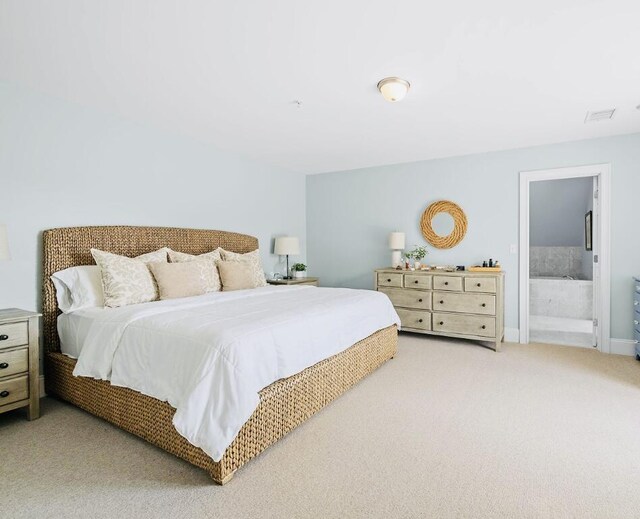 75 Clearwater Dr Unit 305, Falmouth, ME 04105 - bedroom with connected bathroom, visible vents, and light carpet