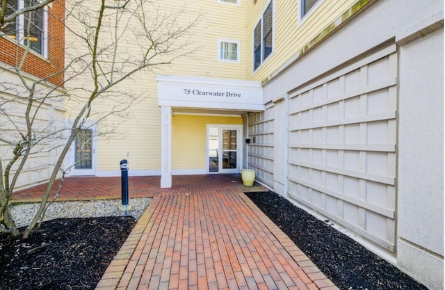 75 Clearwater Dr Unit 305, Falmouth, ME 04105 - entrance to property featuring a garage