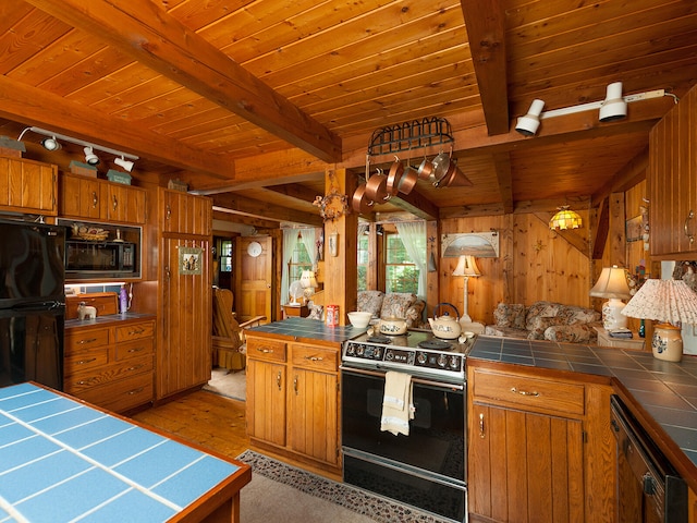 kitchen featuring tile countertops, brown cabinets, wooden ceiling, beamed ceiling, and black appliances