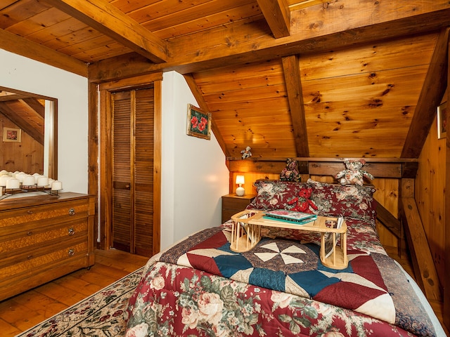 bedroom with wood ceiling, vaulted ceiling with beams, wood walls, and hardwood / wood-style flooring