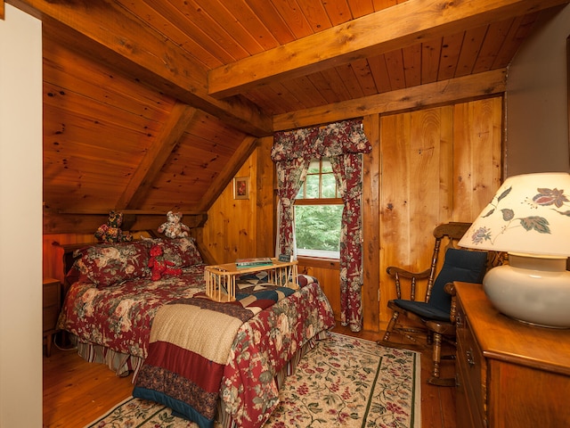 bedroom with lofted ceiling with beams, wood ceiling, wood walls, and hardwood / wood-style floors