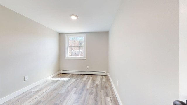 12 Marble Ln, Dixfield, ME 04224 - unfurnished room featuring a baseboard heating unit, light wood finished floors, and baseboards