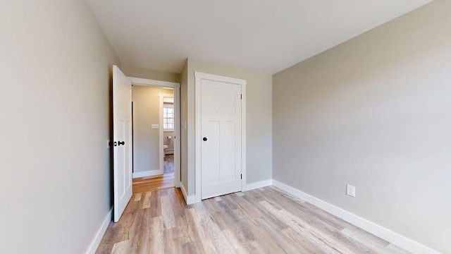 12 Marble Ln, Dixfield, ME 04224 - unfurnished bedroom featuring light wood-type flooring, baseboards, and a closet