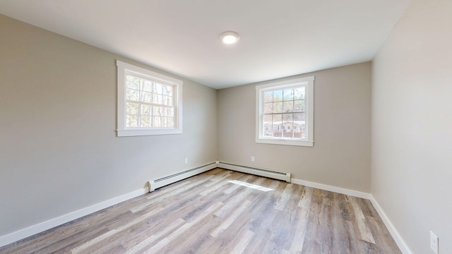 12 Marble Ln, Dixfield, ME 04224 - unfurnished room featuring wood finished floors, baseboards, and baseboard heating