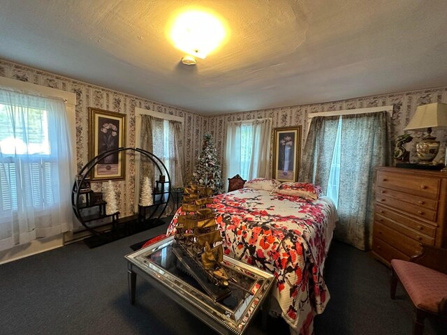 344 Main St, Lincoln, ME 04457 - carpeted bedroom with wallpapered walls