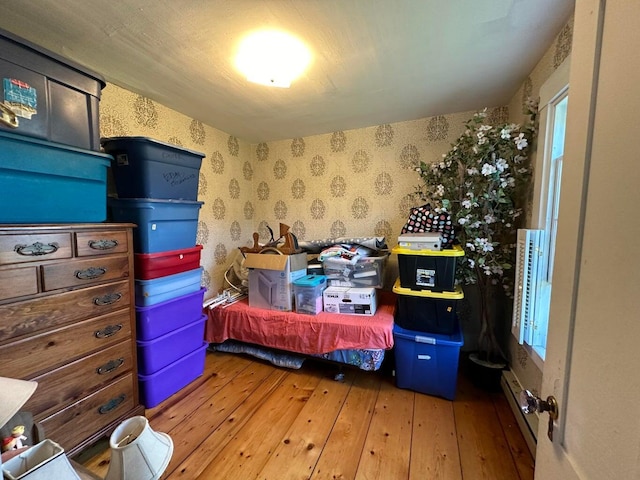 344 Main St, Lincoln, ME 04457 - bedroom with wallpapered walls and hardwood / wood-style floors
