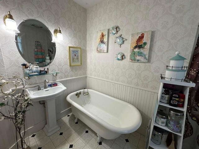 344 Main St, Lincoln, ME 04457 - full bath with a sink, tile patterned floors, a soaking tub, and wallpapered walls